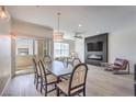 Open concept living space featuring a dining area with a large table and access to an outdoor balcony at 8777 W Maule Ave # 3090, Las Vegas, NV 89148