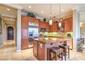 Spacious kitchen featuring stainless steel appliances, granite counters, and ample cabinet space at 10 Via Visione # 103, Henderson, NV 89011