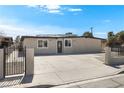 Well-kept single-story home showcasing a fenced yard with an expanded driveway for additional parking at 2729 Flower Ave, North Las Vegas, NV 89030