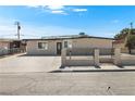 Charming single-story house with a well-maintained front yard, secure fence, and plenty of parking at 2729 Flower Ave, North Las Vegas, NV 89030