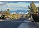 Day view of Las Vegas skyline over a residential neighborhood under a cloudy sky at 2736 Darby Falls Dr, Las Vegas, NV 89134