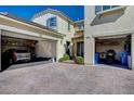 This home features two separate garages, with space for vehicles and storage at 352 Sidewheeler St, Henderson, NV 89012