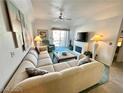 Comfortable living room with large sectional sofa, fireplace, and plenty of natural light at 3550 Bay Sands Dr # 3089, Laughlin, NV 89029