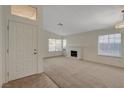 Inviting living room with a brick fireplace, ample natural light, and neutral carpet at 3667 Edinburgh Dr, Las Vegas, NV 89103