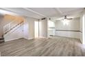 Bright, open-concept living space showcasing durable flooring, staircase access, and cozy dining area at 3683 Villa Knolls East Dr, Las Vegas, NV 89120