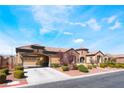 Charming home featuring private gated parking, desert landscaping, and a well-manicured yard at 5027 Crown Cypress St, Las Vegas, NV 89149