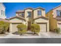 Inviting two-story home with a charming facade, dual car garage, and well-maintained landscaping at 5948 Sakhalin Ave, Las Vegas, NV 89139