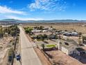 View of the neighborhood with houses, desert landscaping, mountain views, and clear blue skies at 78 Siddall Ave, Las Vegas, NV 89183