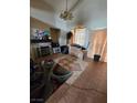 Cozy living room with tile flooring, fireplace, and vintage chandelier at 8124 Kokoma Dr, Las Vegas, NV 89128