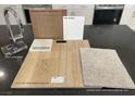 Selection of premium kitchen finishes, including quartz countertops, stylish cabinets, and modern faucet at 9237 Soho Sky Ct, Las Vegas, NV 89148