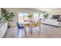 Open dining room area with backyard access, natural light, and tile flooring at 1027 Gentle Swan St # 689, Henderson, NV 89011