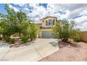 Charming two-story home with a well-manicured yard, mature trees, and a spacious driveway at 11769 Via Vera Cruz Ct, Las Vegas, NV 89138