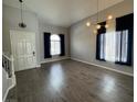 Bright living room with wood floors and modern lighting at 11769 Via Vera Cruz Ct, Las Vegas, NV 89138