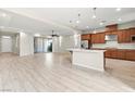 Open-concept living space featuring tile floors, a ceiling fan, and sliding glass doors at 11843 Cogoleto Ave, Las Vegas, NV 89138