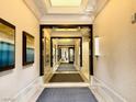 Elegant hallway with artwork and lighting leading to other areas at 125 E Harmon Ave # 1003, Las Vegas, NV 89109