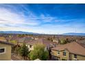 Neighborhood aerial showcasing the rooflines and panoramic views of the city and mountains at 1329 Jewelstone Cir, Henderson, NV 89012
