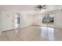 Bright living room featuring tiled floor, ceiling fan, and sliding glass doors at 1520 Teton St, Las Vegas, NV 89101