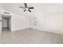 Spacious living room with tiled floors and ceiling fan at 1520 Teton St, Las Vegas, NV 89101