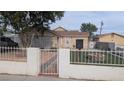Beautiful house with a well-maintained yard, decorative mailbox and gated entry at 1910 Hoover St, North Las Vegas, NV 89030