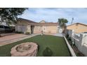 Cozy home with manicured lawn, brick accents, and decorative fountain at 1910 Hoover St, North Las Vegas, NV 89030