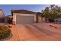 Charming single-story home featuring desert landscaping, a two-car garage, and a welcoming entrance at 2341 Rosendale Village Ave, Henderson, NV 89052