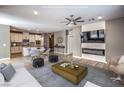 Open-concept living space with modern décor, light wood floors, and a seamless flow to the kitchen area at 2555 Hampton Rd # 4204, Henderson, NV 89052
