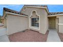Close up view of a single story home entrance with desert landscaping and a security door at 3417 Steppe St, North Las Vegas, NV 89032