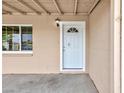 Covered entry featuring a white front door with a window accent at 4213 Hayes Pl, Las Vegas, NV 89107