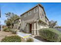Charming two-story townhome featuring a well-maintained front yard and inviting entrance at 470 Dorchester Bend Ave # 3, North Las Vegas, NV 89032