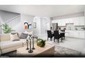 Open floor plan showcases living room and kitchen with modern décor and stainless appliances at 474 Ylang Pl # Lot 7, Henderson, NV 89015