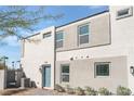Stylish two-story home featuring modern architecture with a gate and muted color scheme at 4915 Chidlaw Ave # 2, Las Vegas, NV 89115
