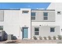 Stylish two-story home featuring modern architecture with a gate and muted color scheme at 4915 Chidlaw Ave # 2, Las Vegas, NV 89115