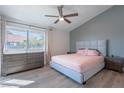 Stylish bedroom featuring a ceiling fan, a serene color palette, and plenty of natural light at 5040 S Rainbow Blvd # 201, Las Vegas, NV 89118