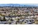 A high angle view showcasing the Las Vegas skyline with homes in the foreground at 5065 Atherton St, Las Vegas, NV 89120