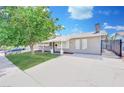 Inviting single-story home featuring a spacious driveway and manicured lawn at 5376 Hillsboro Ln, Las Vegas, NV 89120