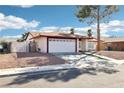 Quaint one-story home with a two car garage, low maintenance landscaping, and a driveway at 6325 Miraloma St, Las Vegas, NV 89108