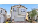Charming two-story home featuring desert landscaping, a two-car garage, and neutral-toned stucco exterior at 6957 Antequera St, Las Vegas, NV 89149