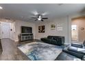 Cozy living room with dark wood floors, contemporary decor, and neutral wall colors at 7113 Forest Heights Ct, Las Vegas, NV 89166