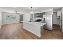 An open kitchen showcases a quartz countertop and stainless steel appliances at 728 Carpenter Dr, Las Vegas, NV 89107