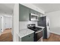Updated kitchen with new appliances and quartz countertops at 728 Carpenter Dr, Las Vegas, NV 89107