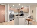 Modern kitchen features stainless steel appliances, granite countertops, and wood cabinetry at 8255 S Las Vegas Blvd # 1907, Las Vegas, NV 89123