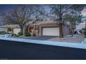 Charming single-story home featuring a two-car garage, mature landscaping and solar panels at 2508 Palmridge Dr, Las Vegas, NV 89134