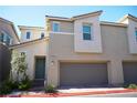 Inviting two-story home featuring an attached two-car garage and well-maintained landscaping at 2765 Frosted Teal Ave, North Las Vegas, NV 89086