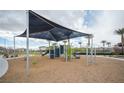 Community playground with sunshades, play structures and ample space for children at 2765 Frosted Teal Ave, North Las Vegas, NV 89086