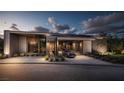 Modern home with a sleek design, featuring a well-manicured lawn and stylish driveway, showcasing contemporary elegance at 3 Climbing Canyon Dr, Henderson, NV 89052