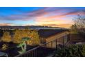 Panoramic view of the mountains and city lights from the fenced backyard and patio at 3042 Lake Barkley Rd, Henderson, NV 89052