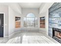 Bright living room featuring marble floors, statement fireplace, and modern windows for natural light at 3108 Ocotillo Dr, Laughlin, NV 89029