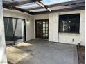 An outdoor covered patio area featuring a pergola, concrete, and doors to the house at 3422 Pino Cir, Las Vegas, NV 89121