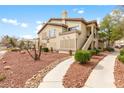 Attractive multi-story condo with well-kept landscaping and exterior staircases to upper units at 5710 E Tropicana Ave # 1166, Las Vegas, NV 89122