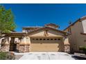 Charming single-Gathering home featuring a two-car garage and a well-maintained front yard at 6036 Sierra Lakes St, North Las Vegas, NV 89031
